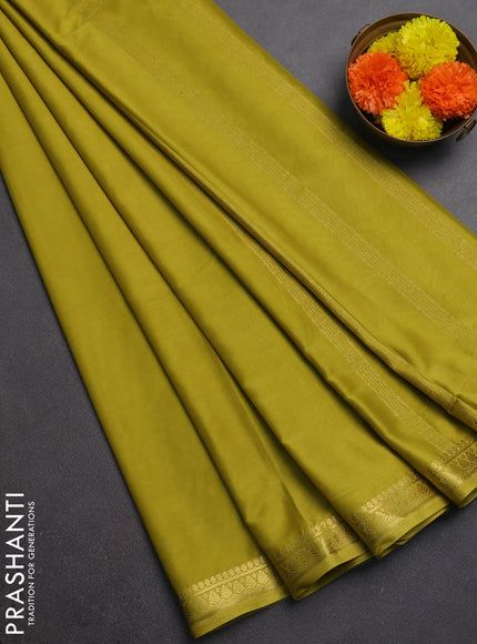 Semi mysore silk saree lime green with plain body and small zari woven border
