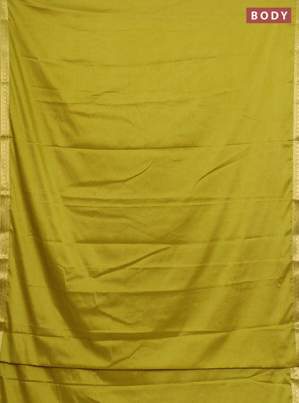 Semi mysore silk saree lime green with plain body and small zari woven border