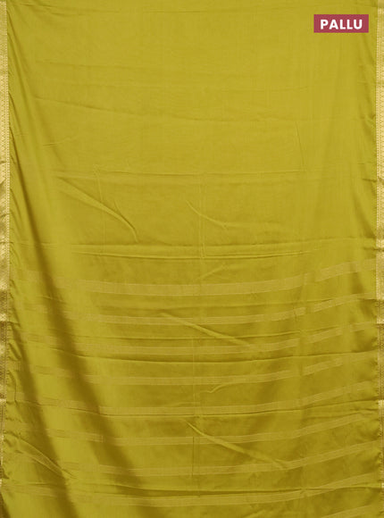 Semi mysore silk saree lime green with plain body and small zari woven border