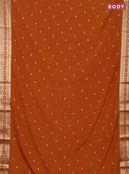 Semi mysore silk saree rust shade with allover zari woven buttas and zari woven border