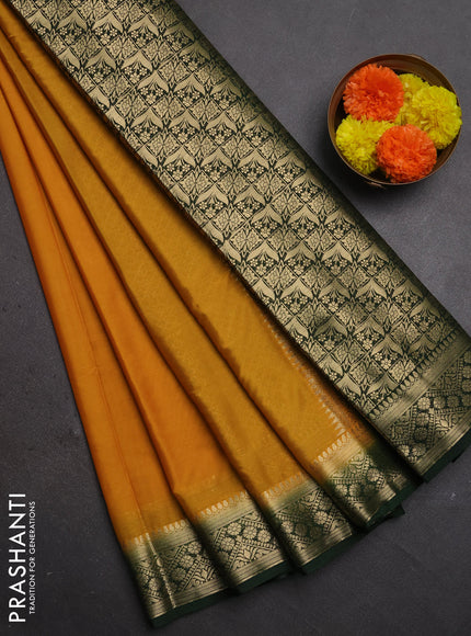 Semi mysore silk saree mustard yellow and green with plain body and zari woven border