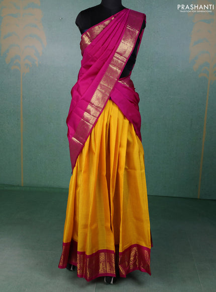 Pure kanchipuram silk lehenga dhawani yellow and magenta pink with allover checked pattern and rich zari woven border