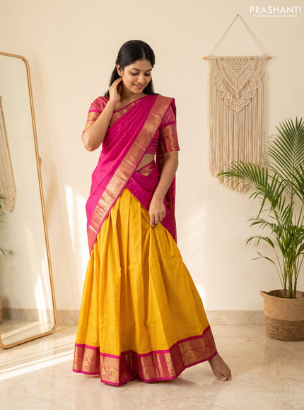 Pure kanchipuram silk lehenga dhawani yellow and magenta pink with allover checked pattern and rich zari woven border