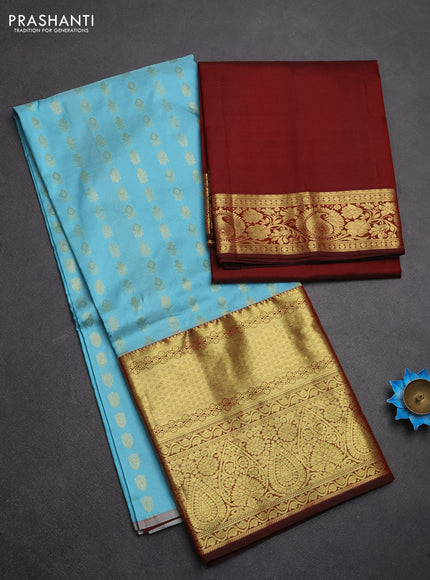 Pure kanchipuram silk lehenga dhawani mild teal blue and maroon with allover zari woven buttas and long rich zari woven border