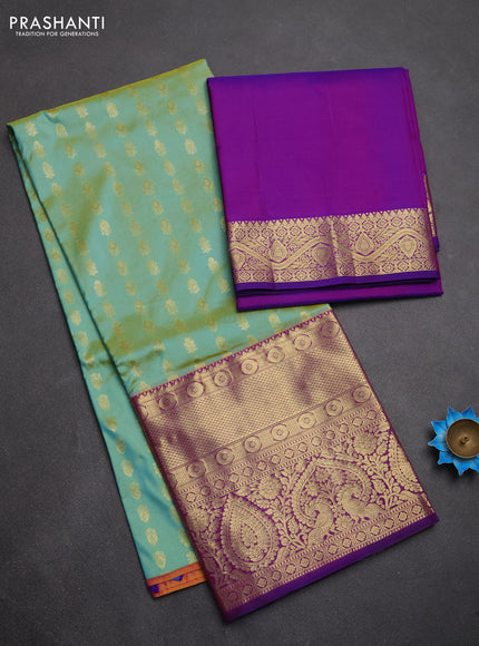 Pure kanchipuram silk lehenga dhawani dual shade of teal and purple with allover zari woven butta weaves and long rich zari woven border