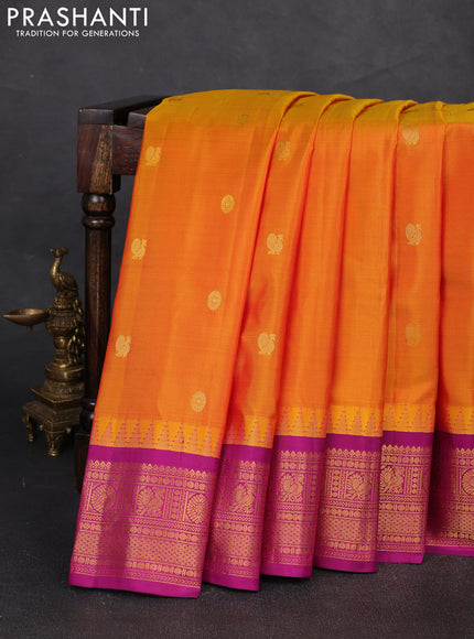 Pure gadwal silk saree dual shade of mustard yellow and purple with zari woven buttas and temple design zari woven border