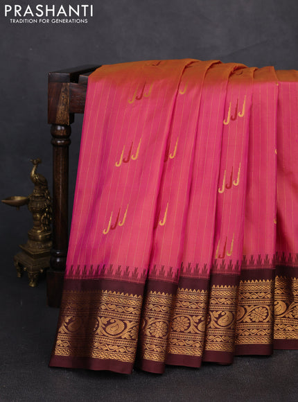 Pure gadwal silk saree dual shade of pink and coffee brown with allover zari strips & muniya buttas and temple design zari woven border