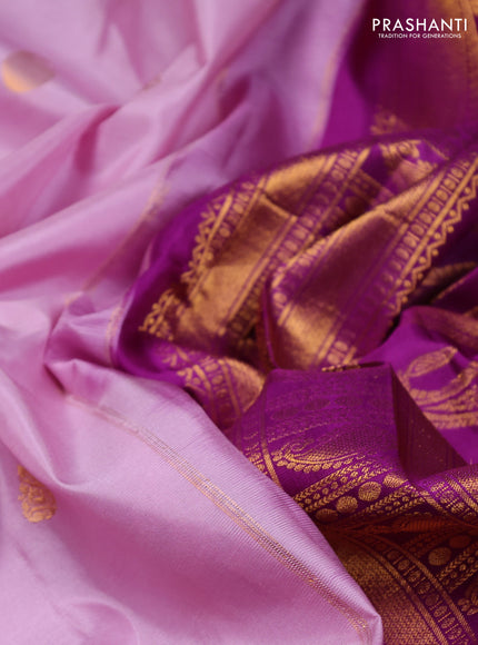 Pure gadwal silk saree mild lavender and purple with zari woven buttas and temple design zari woven border