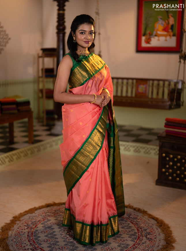 Pure gadwal silk saree peach shade and green with zari woven buttas and temple design zari woven border