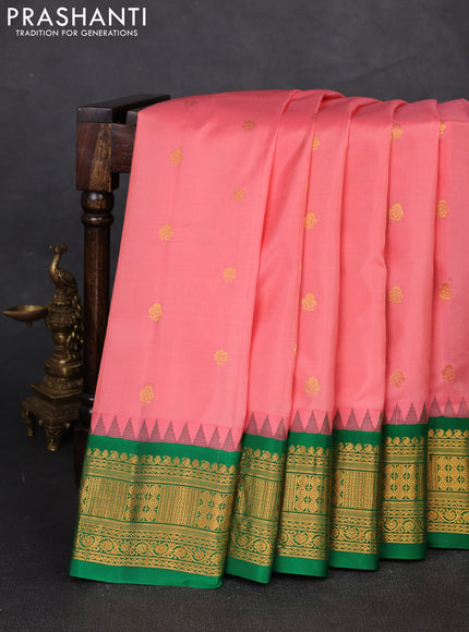 Pure gadwal silk saree peach shade and green with zari woven buttas and temple design zari woven border
