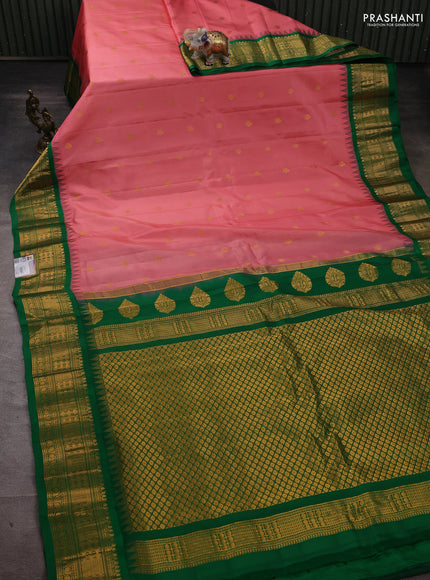 Pure gadwal silk saree peach shade and green with zari woven buttas and temple design zari woven border