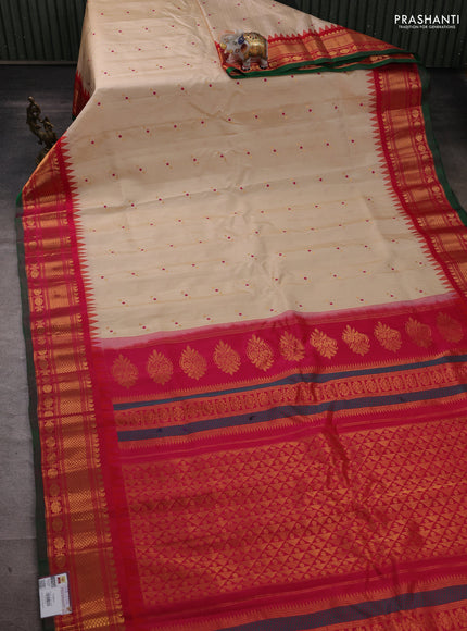 Pure gadwal silk saree cream and pink with allover zari strips & buttas and temple design zari woven border