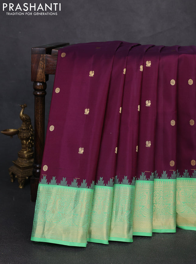 Pure gadwal silk saree deep purple and teal green with zari woven buttas and temple design zari woven border