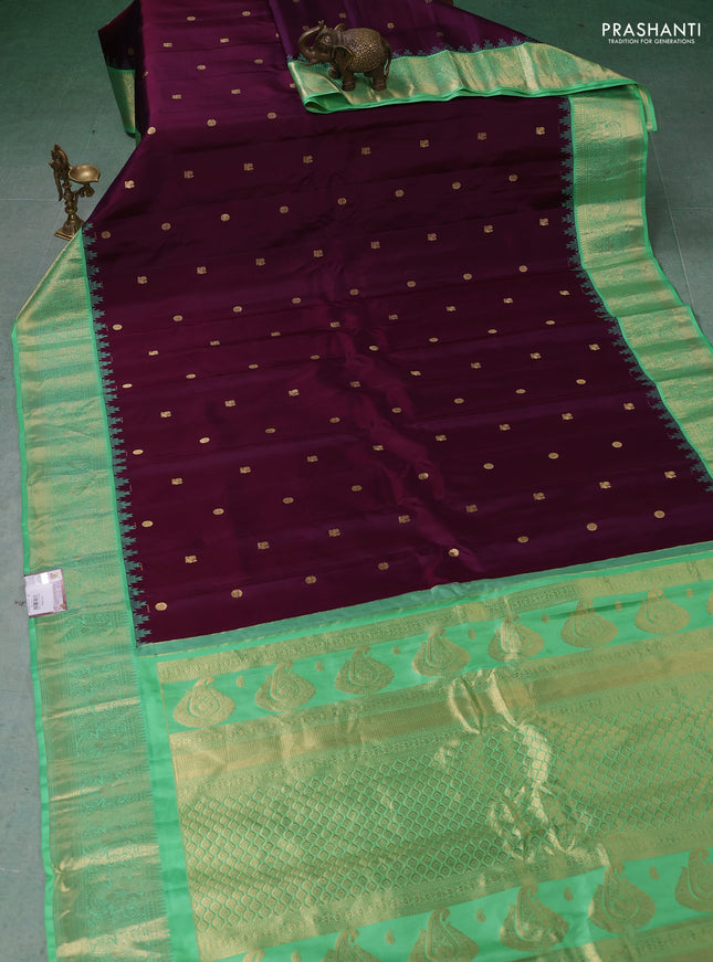 Pure gadwal silk saree deep purple and teal green with zari woven buttas and temple design zari woven border