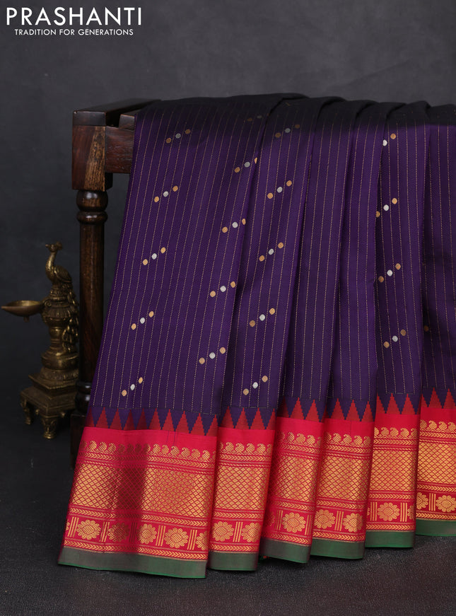 Pure gadwal silk saree navy blue and reddish pink with allover zari strips & buttas and temple design zari woven border