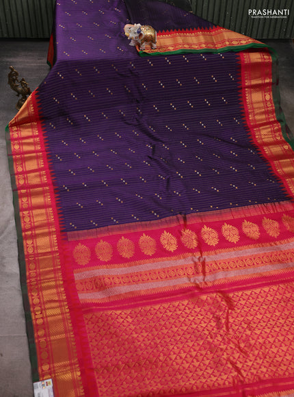 Pure gadwal silk saree navy blue and reddish pink with allover zari strips & buttas and temple design zari woven border
