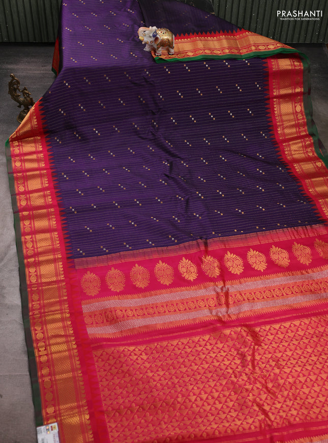 Pure gadwal silk saree navy blue and reddish pink with allover zari strips & buttas and temple design zari woven border