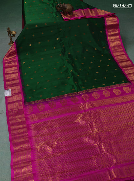 Pure gadwal silk saree bottle green and magenta pink with zari woven buttas and temple design zari woven border