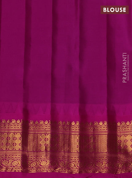 Pure gadwal silk saree bottle green and magenta pink with zari woven buttas and temple design zari woven border