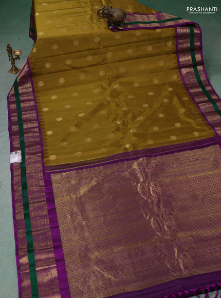 Pure gadwal silk saree mustard green and purple with zari woven buttas and temple design rettapet zari woven border