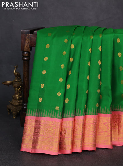 Pure gadwal silk saree green and peach shade with zari woven buttas and temple design zari woven border