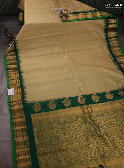 Pure gadwal silk saree elaichi green and green with zari woven buttas and temple design zari woven border