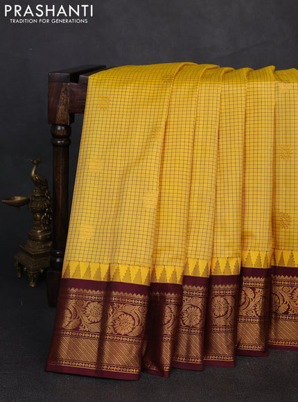 Pure gadwal silk saree yellow and deep maroon with allover checks & zari buttas and temple design zari woven border