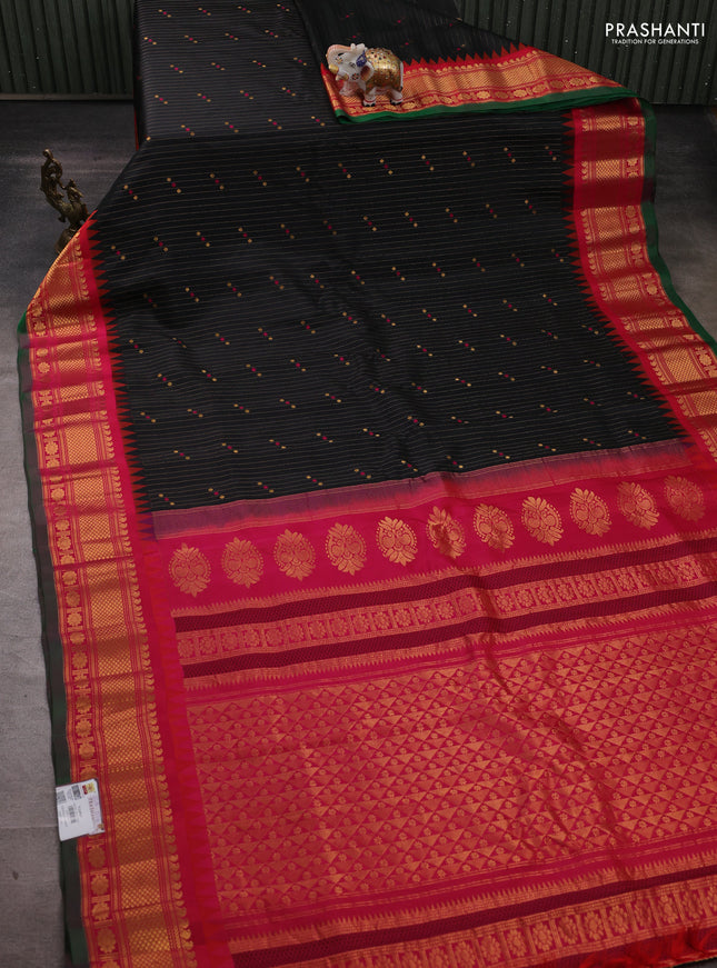 Pure gadwal silk saree black and pink with allover zari strips & buttas and temple design zari woven border