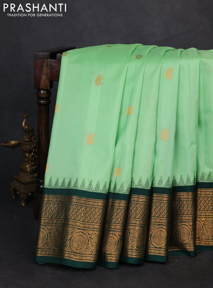Pure gadwal silk saree pista green and dark green with zari woven buttas and temple design zari woven border