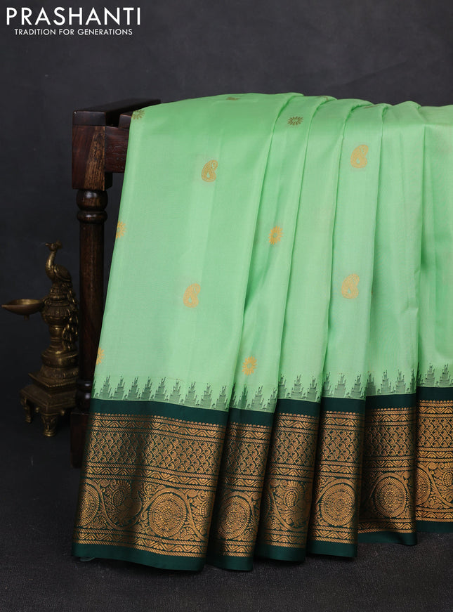 Pure gadwal silk saree pista green and dark green with zari woven buttas and temple design zari woven border