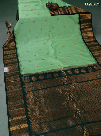 Pure gadwal silk saree pista green and dark green with zari woven buttas and temple design zari woven border