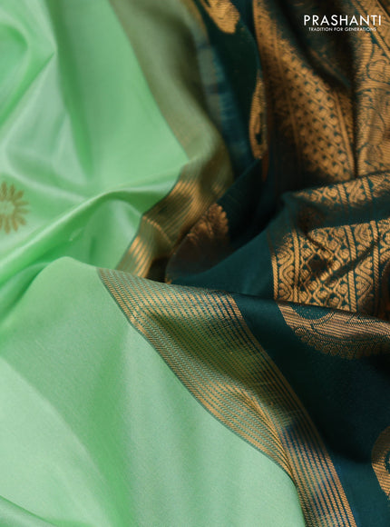 Pure gadwal silk saree pista green and dark green with zari woven buttas and temple design zari woven border