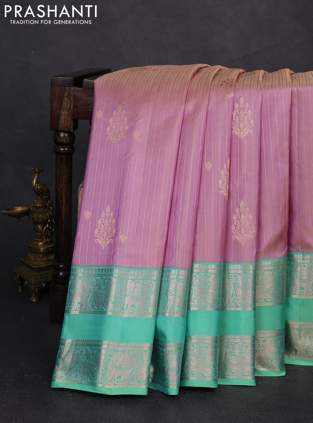 Pure gadwal silk saree pastel lavender and teal green shade with allover zari stripe pattern and rettapet zari woven border