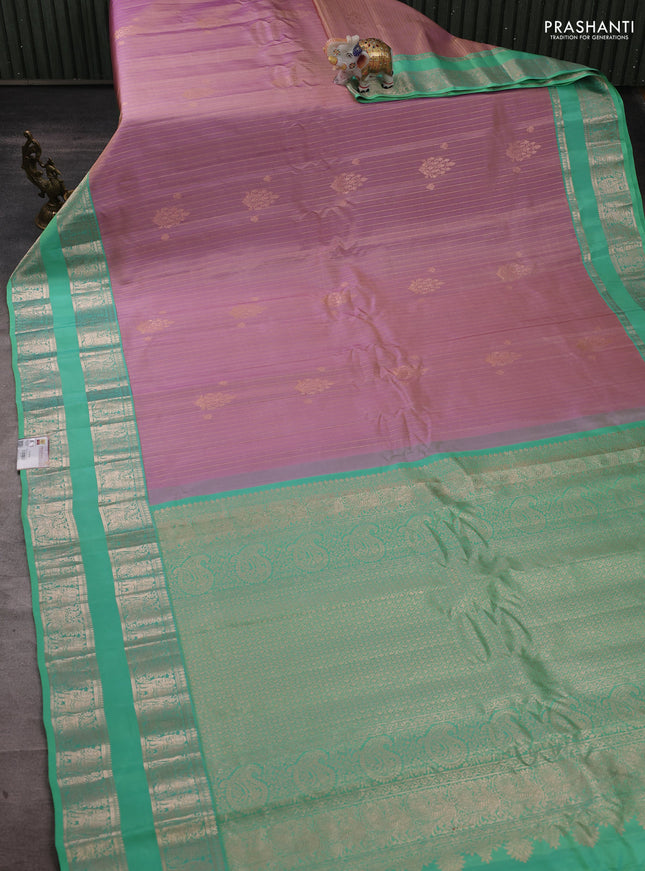 Pure gadwal silk saree pastel lavender and teal green shade with allover zari stripe pattern and rettapet zari woven border