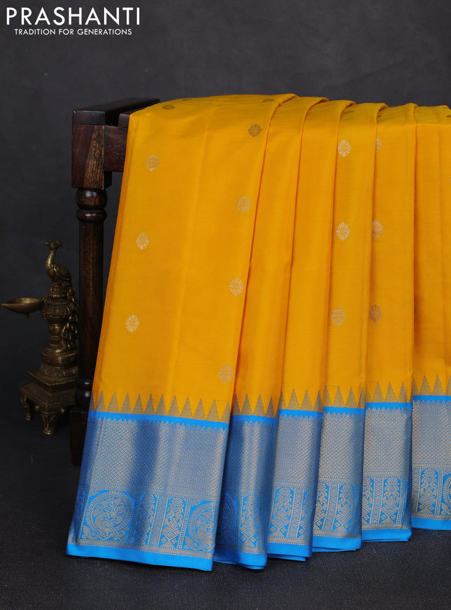 Pure gadwal silk saree yellow and cs blue with zari woven buttas and temple design zari woven border