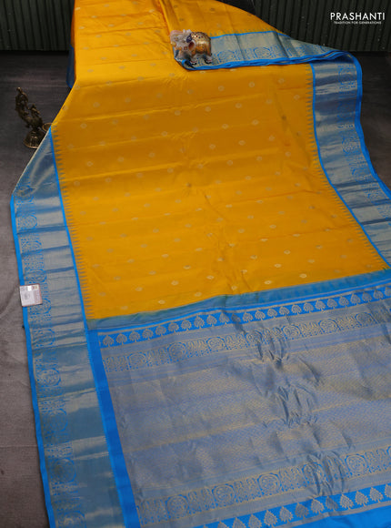 Pure gadwal silk saree yellow and cs blue with zari woven buttas and temple design zari woven border