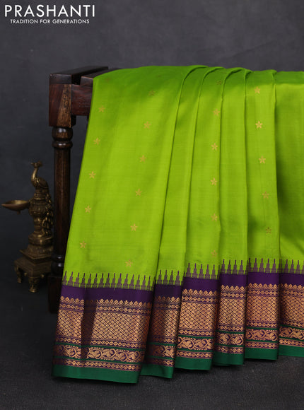 Pure gadwal silk saree light green and deep violet with zari woven buttas and temple design zari woven border