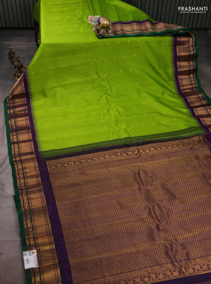 Pure gadwal silk saree light green and deep violet with zari woven buttas and temple design zari woven border