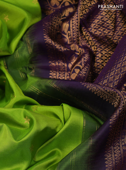 Pure gadwal silk saree light green and deep violet with zari woven buttas and temple design zari woven border