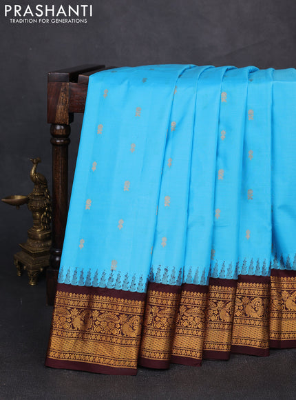Pure gadwal silk saree light blue and coffee brown with zari woven buttas and temple design zari woven border