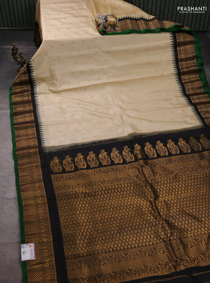 Pure gadwal silk saree cream and black with zari woven buttas and temple design zari woven border