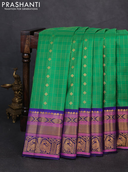 Pure gadwal silk saree green and blue with allover zari checks & buttas and zari woven border