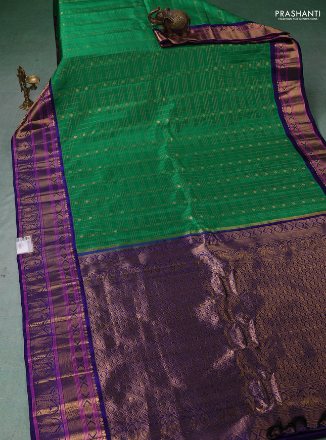 Pure gadwal silk saree green and blue with allover zari checks & buttas and zari woven border