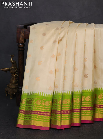 Pure gadwal silk saree cream and light green with paisley zari woven buttas and temple design zari woven border
