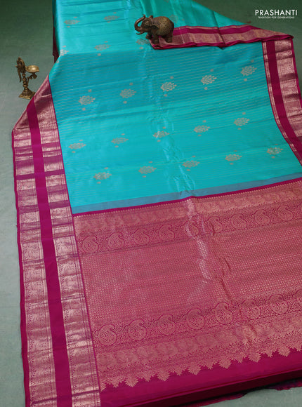 Pure gadwal silk saree teal green and purple with allover zari stripe pattern and rettapet zari woven border