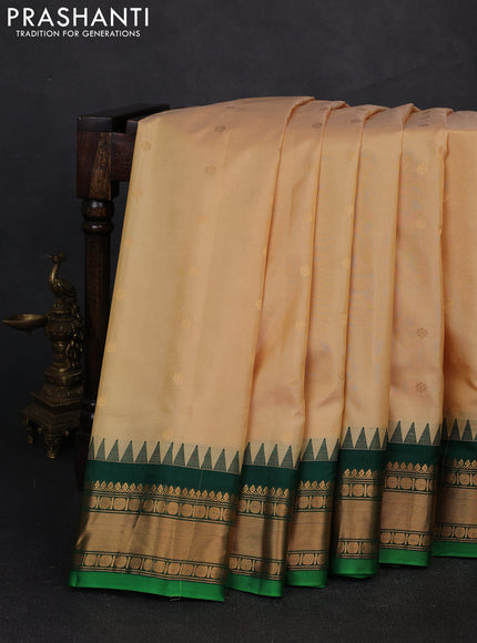 Pure gadwal silk saree cream and green with zari woven buttas and temple design zari woven border