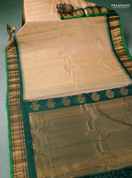 Pure gadwal silk saree cream and green with zari woven buttas and temple design zari woven border