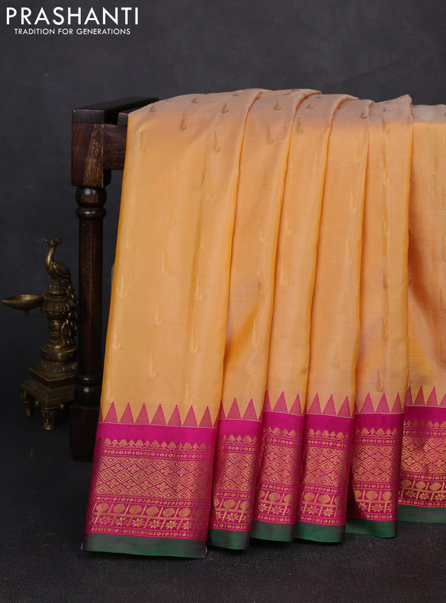 Pure gadwal silk saree pale yellow and magenta pink with zari woven buttas and temple design zari woven border