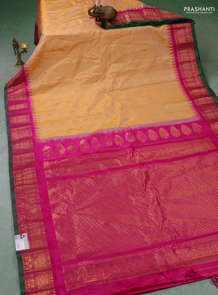 Pure gadwal silk saree pale yellow and magenta pink with zari woven buttas and temple design zari woven border