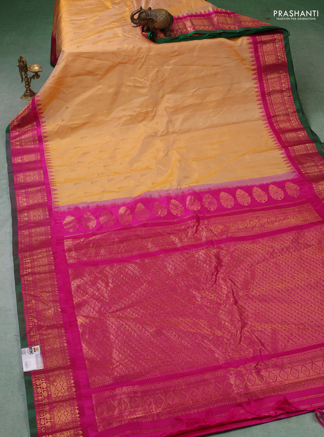 Pure gadwal silk saree pale yellow and magenta pink with zari woven buttas and temple design zari woven border